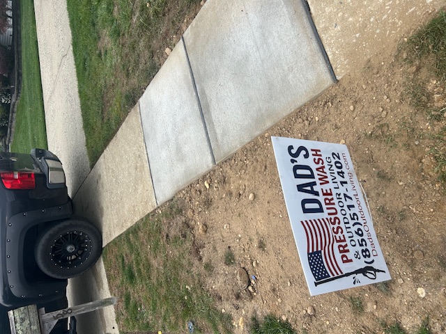 New concrete sidewalk poured and finished in front of a home