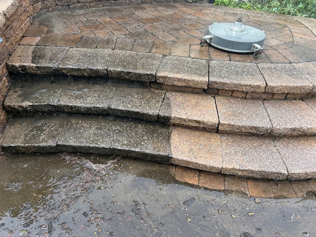 Paver steps mid-clean with surface cleaner showing dramatic before and after